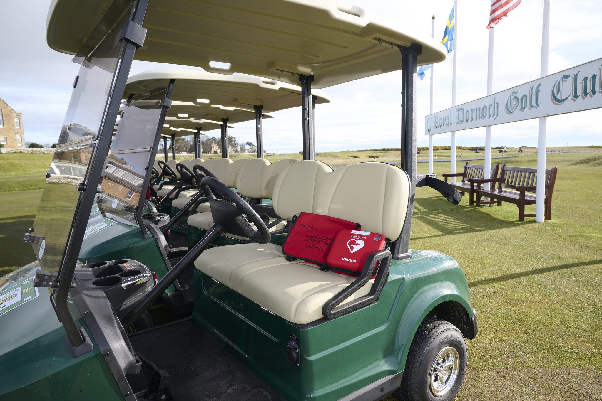 A defibrillator sitting on Royal Dornoch Golf Club's STAR EV Capella.