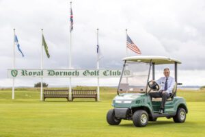 Royal Dornoch's General Manager sitting on a STAR EV Capella 2 Pro on the golf greens.